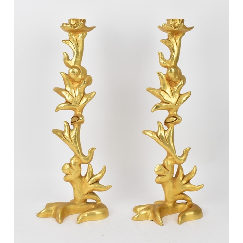 247 - A pair of 1970s gilt-bronze candlesticks by Georges Mathias for Fondica, of naturalistic foliate des... 