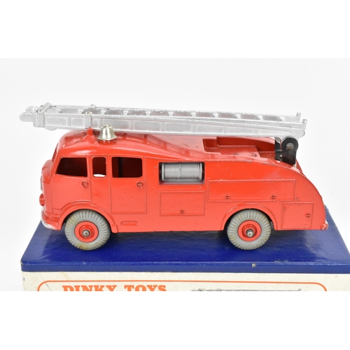 256 - A Dinky 555 Fire Engine with Extending Ladder, in red, with blue cardboard box with orange label, to... 