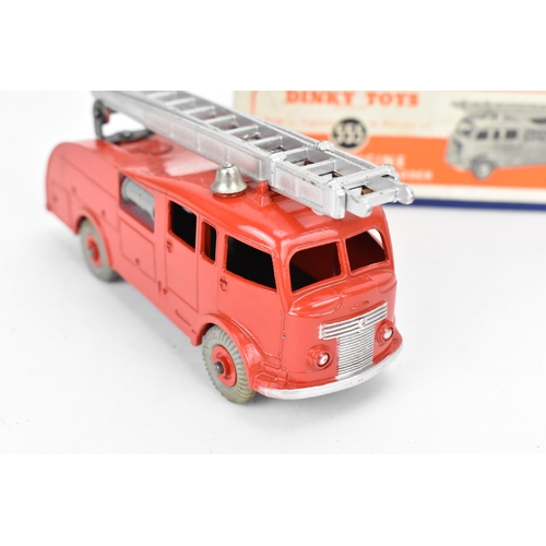 256 - A Dinky 555 Fire Engine with Extending Ladder, in red, with blue cardboard box with orange label, to... 