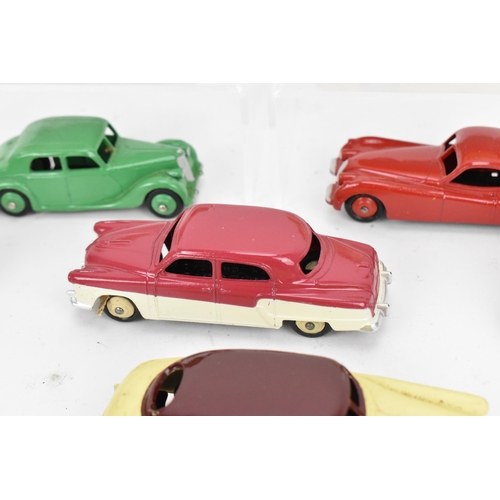 257 - A collection of vintage early Dinky cars, to include a 172 Studebaker Land Cruiser, a Hudson Commodo... 