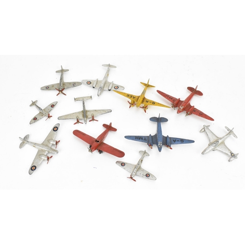 266 - A small collection of Dinky Toys aircraft to include a Light Racer in yellow, two Light Transport in... 