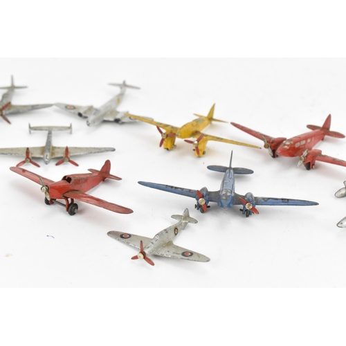 266 - A small collection of Dinky Toys aircraft to include a Light Racer in yellow, two Light Transport in... 