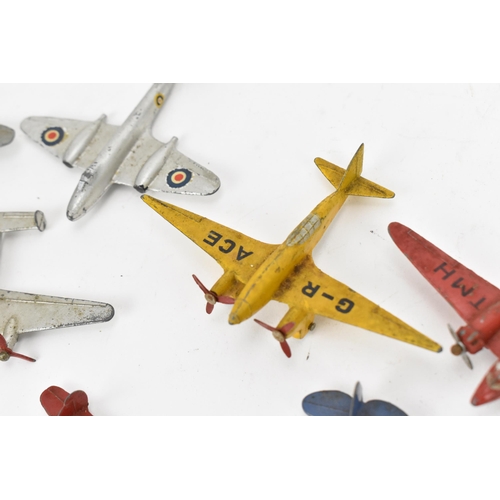 266 - A small collection of Dinky Toys aircraft to include a Light Racer in yellow, two Light Transport in... 