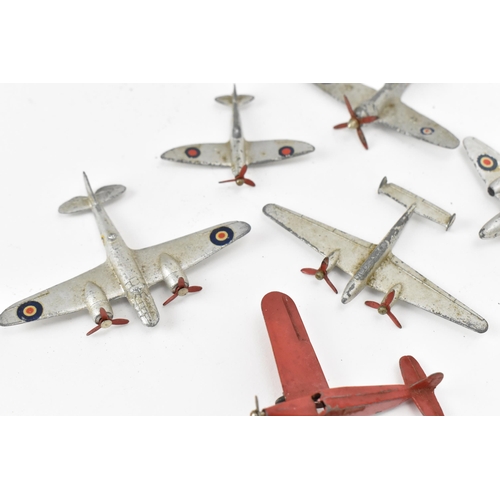 266 - A small collection of Dinky Toys aircraft to include a Light Racer in yellow, two Light Transport in... 