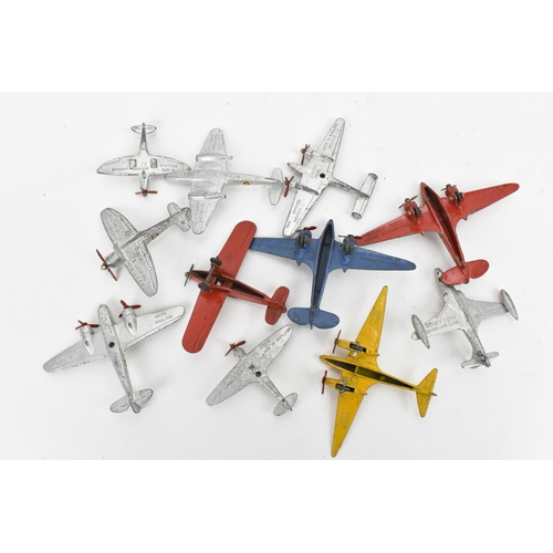 266 - A small collection of Dinky Toys aircraft to include a Light Racer in yellow, two Light Transport in... 