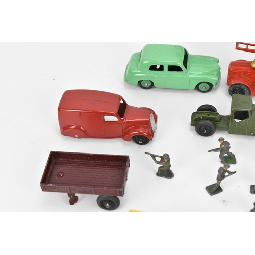 267 - A collection of vintage Dinky diecast cars, to include a 280 delivery van in blue, a 29e single deck... 