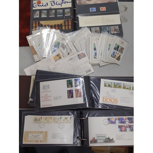 306 - A quantity of First Day covers and mint definitive stamps in five albums to include loose examples, ... 