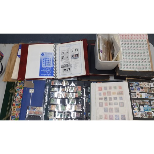 307 - A partially filled 'Life & Times of HM Queen Mother' stamp album together with empty vintage albums,... 