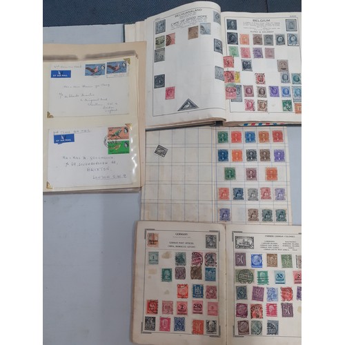 312 - A vintage '1000 Varieties Colonials' Honduras stamp album and two others to include Former German Co... 