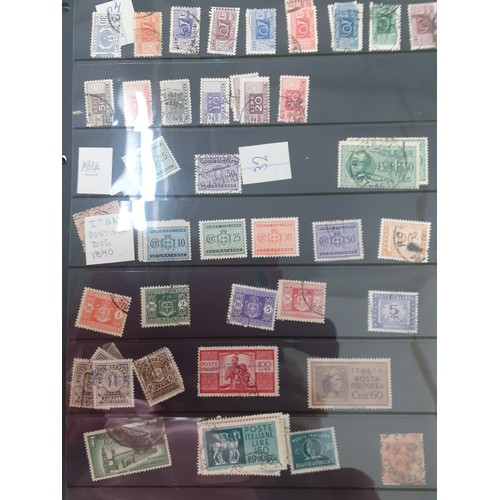 311 - A 20th century stamp album containing Nicaraguan and Rwandan stamps, Worldwide and 1950's Italian Pr... 