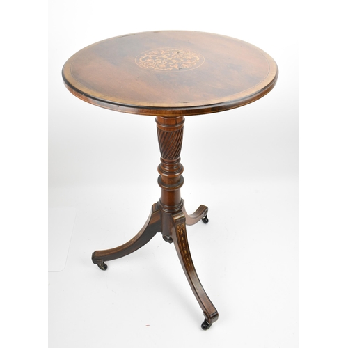 251 - An Edwardian rosewood inlaid tripod table, the circular top with foliate inlaid roundel, resting on ... 