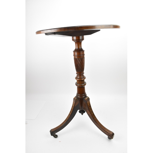 251 - An Edwardian rosewood inlaid tripod table, the circular top with foliate inlaid roundel, resting on ... 