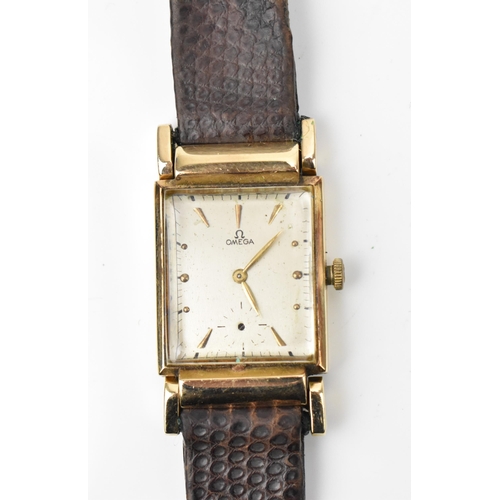 84 - An Omega, manual wind, gents, 14ct gold wristwatch, circa 1940s, having a silvered dial, subsidiary ... 