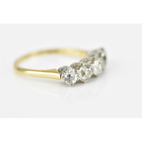 185A - An 18ct gold and five stone diamond ring, set with old cut diamonds in double claw setting, the cent... 