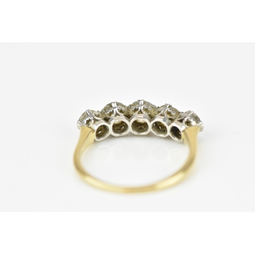 185A - An 18ct gold and five stone diamond ring, set with old cut diamonds in double claw setting, the cent... 