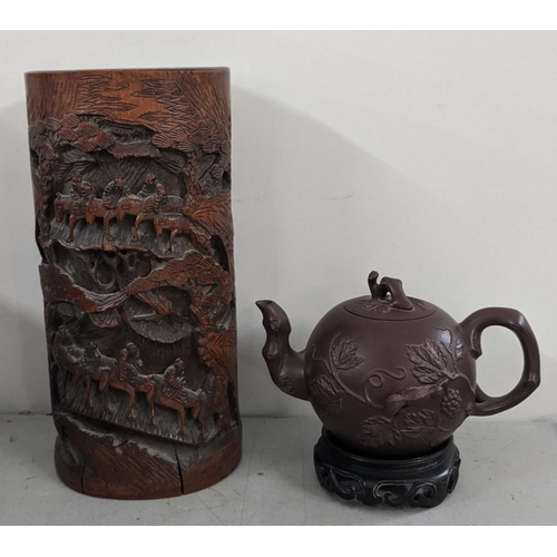 266 - An early 20th century Chinese carved bamboo brush pot together with Yixing teapot character marks to... 