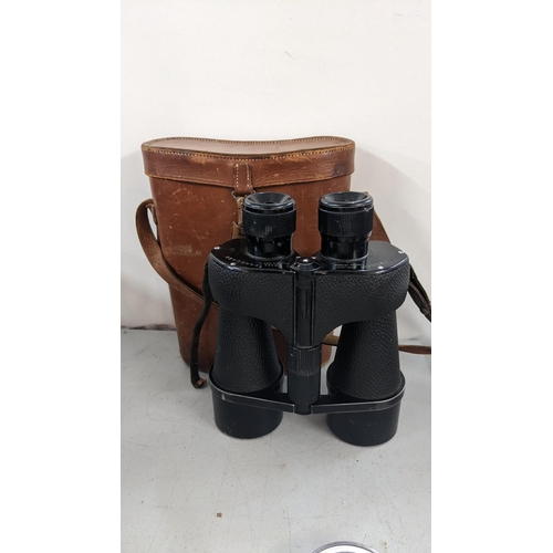 268 - A pair of Kershaw Vanguard binoculars in a fitted leather carry case
Location:A4B