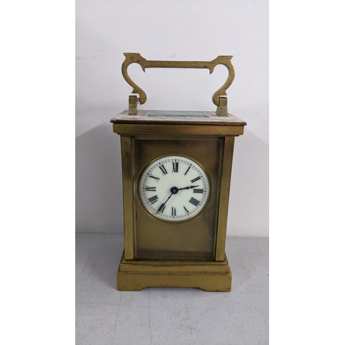 294 - A late 19th century brass carriage clock having platform lever escapement enamel dial with Roman num... 