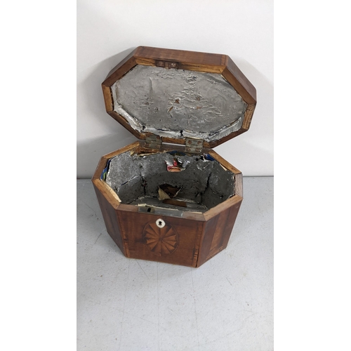 295 - A Georgian Mahogany tea caddy of octagonal form and having marquetry inlaid
Location:4.1