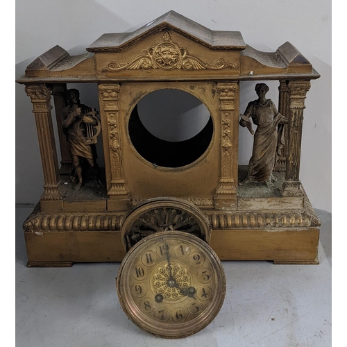 298 - A late 19th century French gilt metal clock of architectural design having two mantel classical figu... 