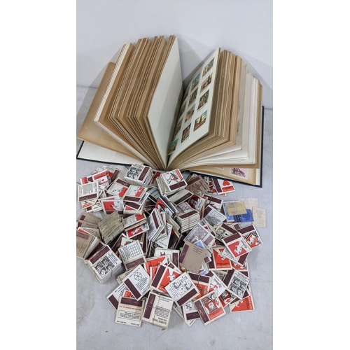 300 - A large collection of matchbox cards and labels to include two albums containing mixed cards from ar... 