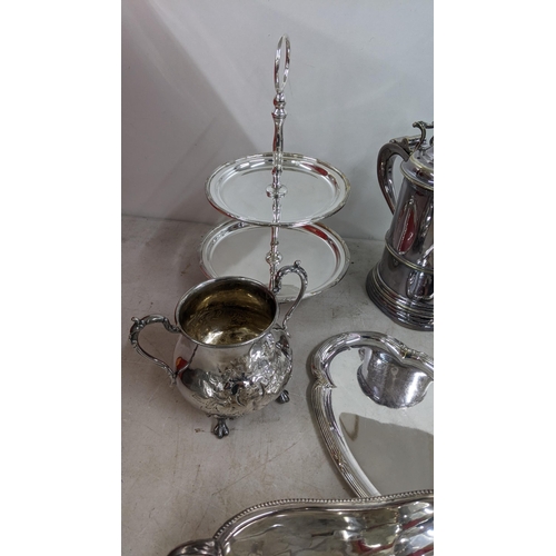 319 - A late 19th century silver plated tankard along with other silver plated items to include a pierced ... 