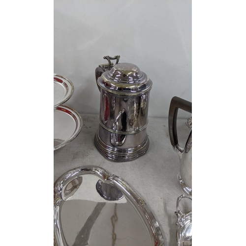 319 - A late 19th century silver plated tankard along with other silver plated items to include a pierced ... 