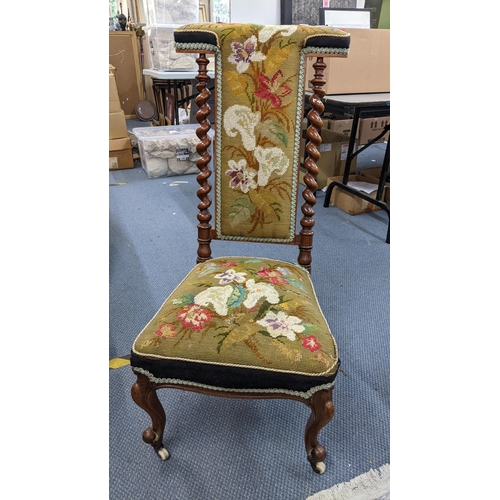 352 - **THIS LOT HAS BEEN WITHDRAWN**
A Victorian walnut prie dieu chair having barley twist supports and ... 