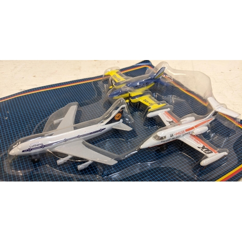 49 - Four Matchbox super vale packs each containing three planes to include US Airforce fighter jet, a Ma... 