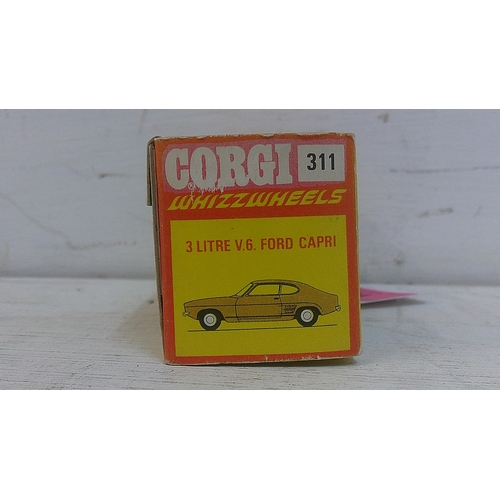 74 - A Corgi Whizzwheels 3 litre V6 Ford Capri 311 in florescent orange, fitted with black interior and r... 