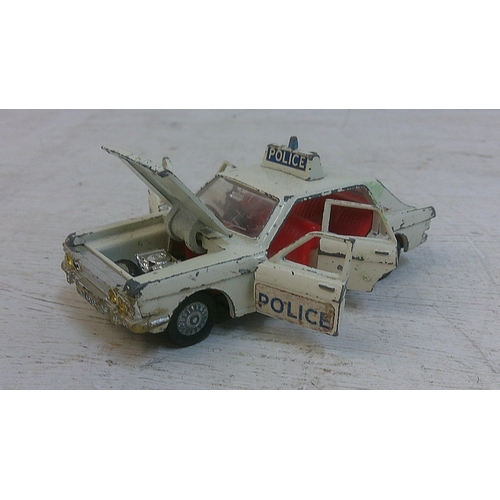 75 - Three Dinky toys to include a Ford Escort Panda police car with original box (270), a Ford Zodiac Pa... 