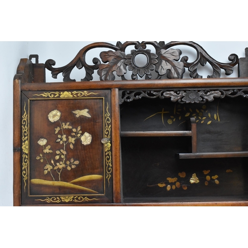 147 - A Japanese Meiji period shibayama inlaid shodona hanging cabinet, circa 1900, with various shelves a... 