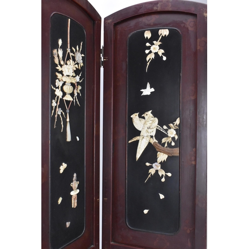 148 - A Japanese lacquer, bone and mother-of-pearl inlaid four-fold screen, circa 1900, each arched panel ... 