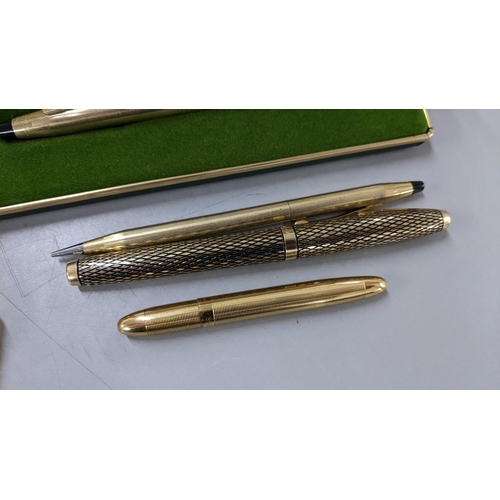 23 - A Shaffer Triumph Imperial gold plated fountain pen, a Cross century ballpoint and rollerball, a s p... 