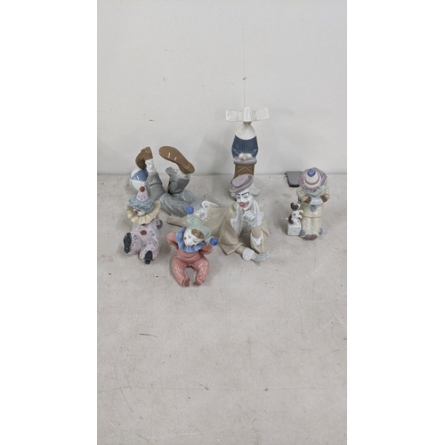 333 - A group of four Lladro figurines and one Lladro Nao figuring to include 4618 reclining clown with ba... 