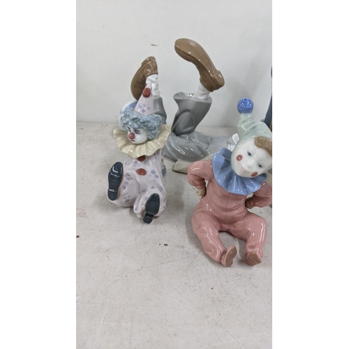 333 - A group of four Lladro figurines and one Lladro Nao figuring to include 4618 reclining clown with ba... 