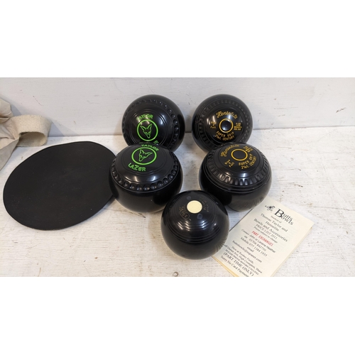 276 - A pair of Henselite 21st century Crown green bowls, a pair of Taylor bowls, a jack and a mat
Locatio... 