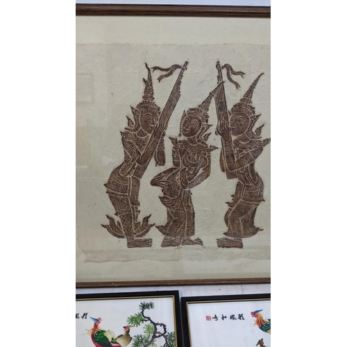 335 - Asian works of art to include a Thai rubbing, two embroideries, and two prints of birds in bamboo Lo... 