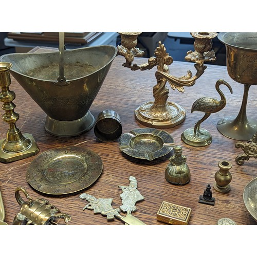 494 - Mixed brass and metalware items to include candle sticks, trophy, floral design photo frame, candle ... 