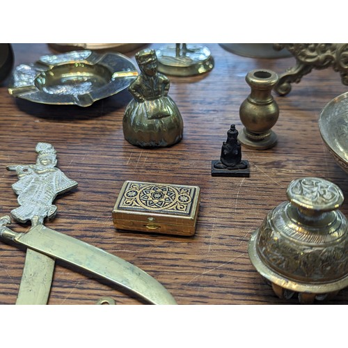 494 - Mixed brass and metalware items to include candle sticks, trophy, floral design photo frame, candle ... 