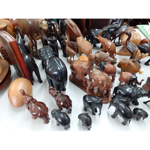 277 - A quantity of African treen carved models of animals together with book ends and other treen collect... 