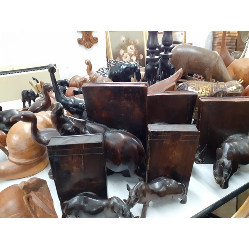 277 - A quantity of African treen carved models of animals together with book ends and other treen collect... 