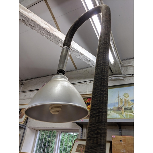 280 - Two Steampunk style lamps, both on cylindrical bases, one made from the components of a vacuum clean... 