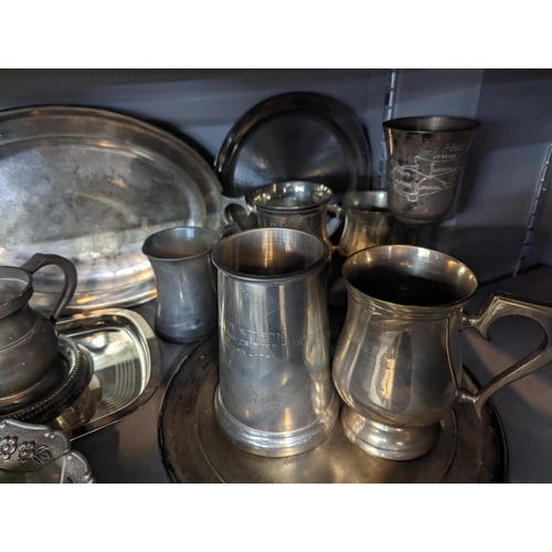 346 - Mixed metalware to include silver plated trays, platter, tankards along with pewter examples
Locatio... 