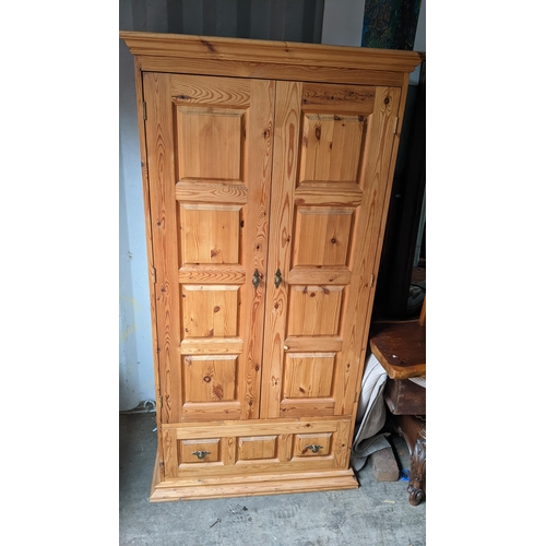 390 - A modern pine two door wardrobe with drawer below, 180.5 x 93.5cm
Location: CONR