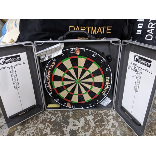 392 - A Unicorn Dartmate folding metal stand in slip case and dart board in case Location: G