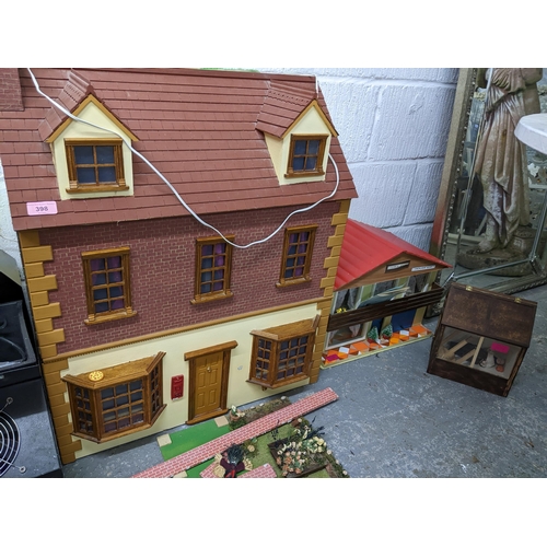 398 - A dolls house with a garden, summer house and a retro dolls house
Location: G