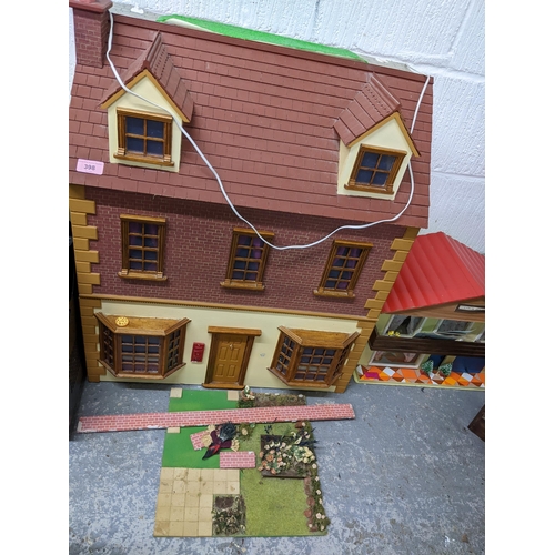 398 - A dolls house with a garden, summer house and a retro dolls house
Location: G