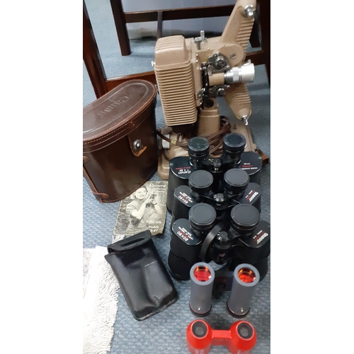 406 - Tasco binoculars, Canon binoculars and a Revere 8mm projector
Location: A1F