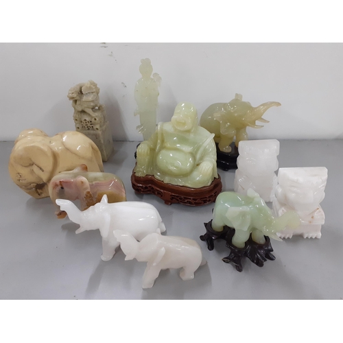 408 - A quantity of jade, jadeite and onyx collectables to include model elephants and buddhas
Location: R... 